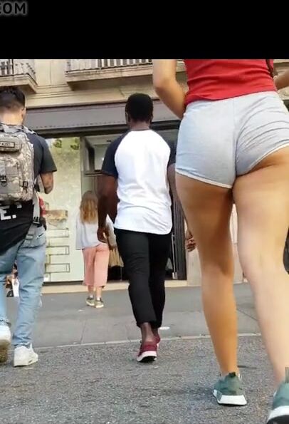 Tanned cheeky booty into short shorts(Immense cameltoe shot)