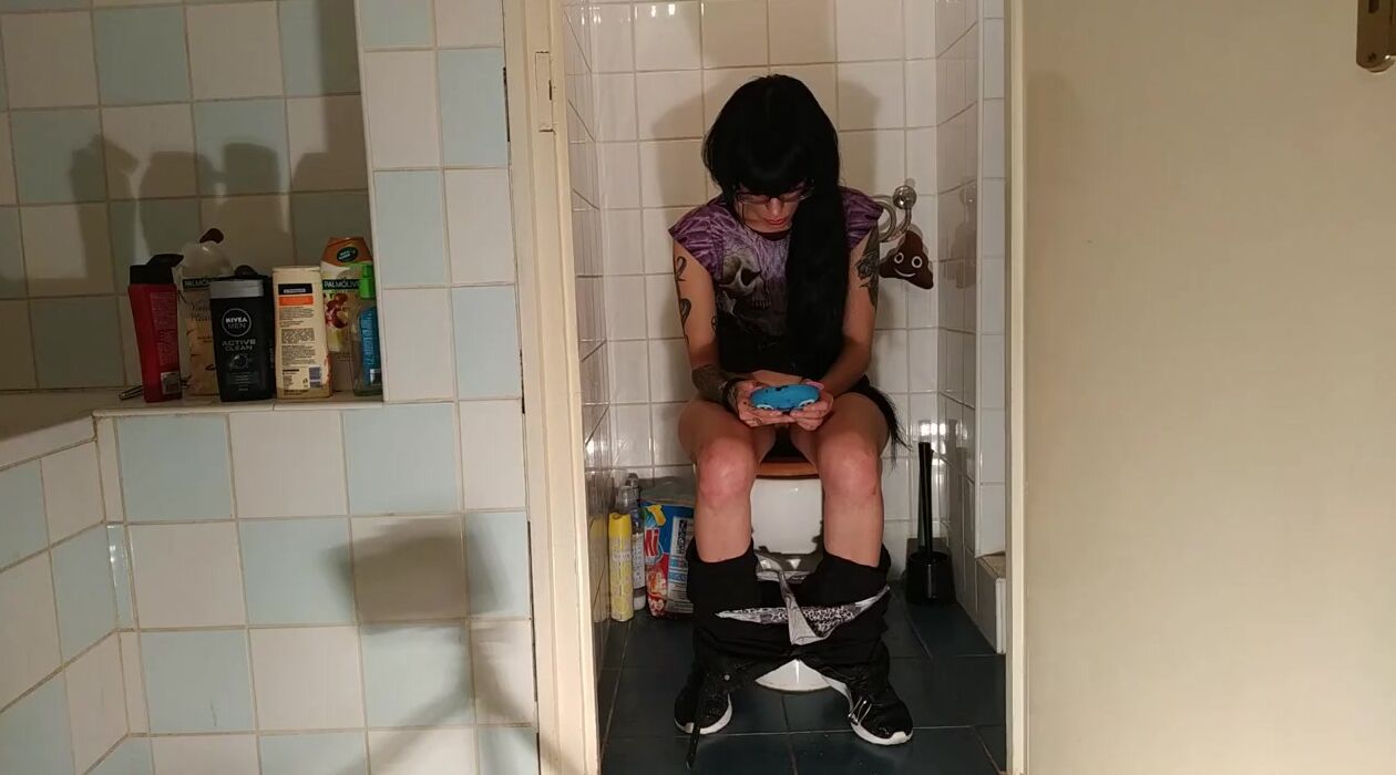 Beauty gothic barely legal pees while having fun with her phone pt2