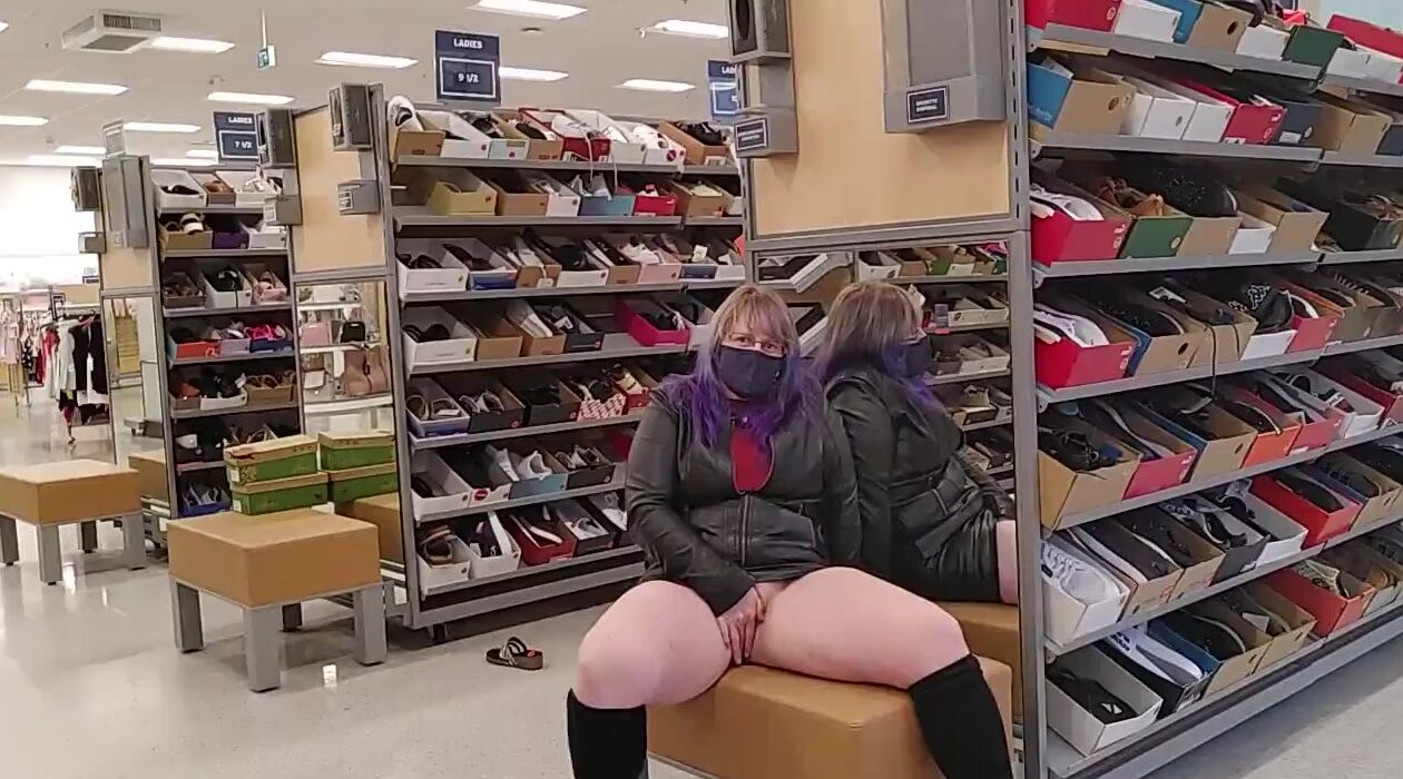 Purple Haired milf inside Leather Mastrubates Vagina into Busy Shoe Store