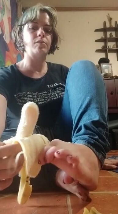 Peels a Banana with her Feet and Takes a Gigantic Bite