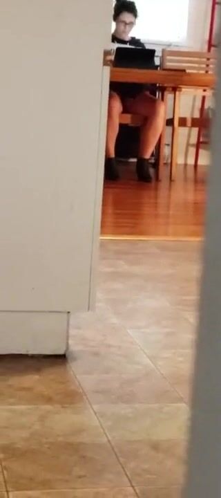 Spying vulgar cunt with mouth watching porn and masturbating under table