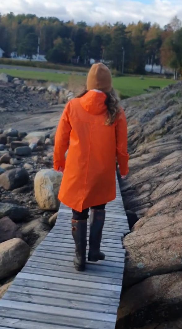 Taking a Stroll inside Orange Raincoat and Latex Boots