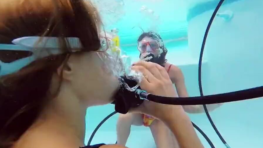 Katya Nakolkina with another chick inside the pool