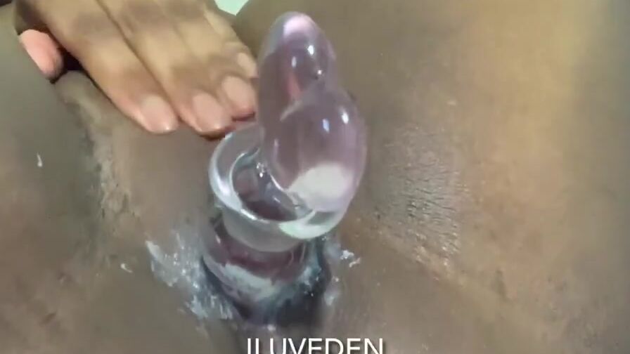 thick african fucks creamy twat with glass sex toy