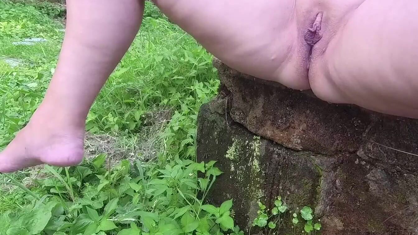 Long pissing sitting outdoor