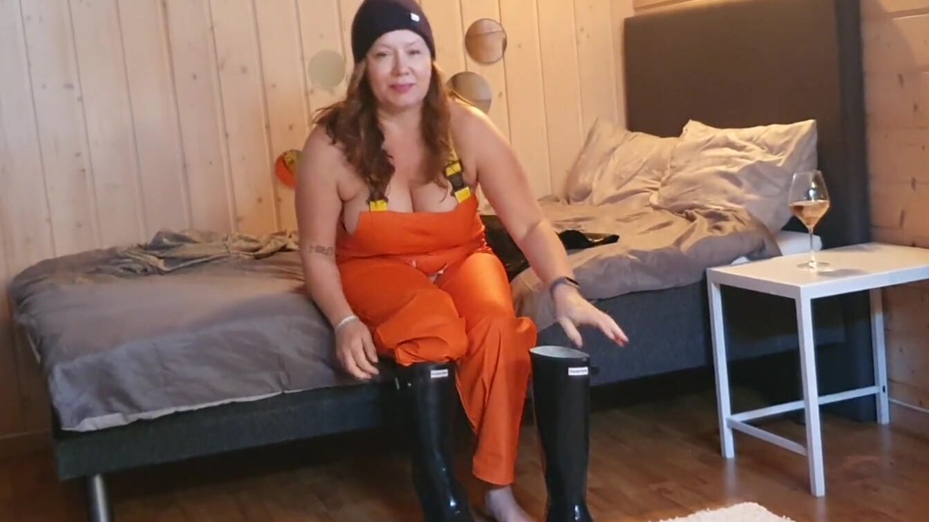 Dressing up inside rainwear and latex boots for sex