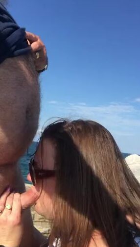 BBW blowing penis at the beach