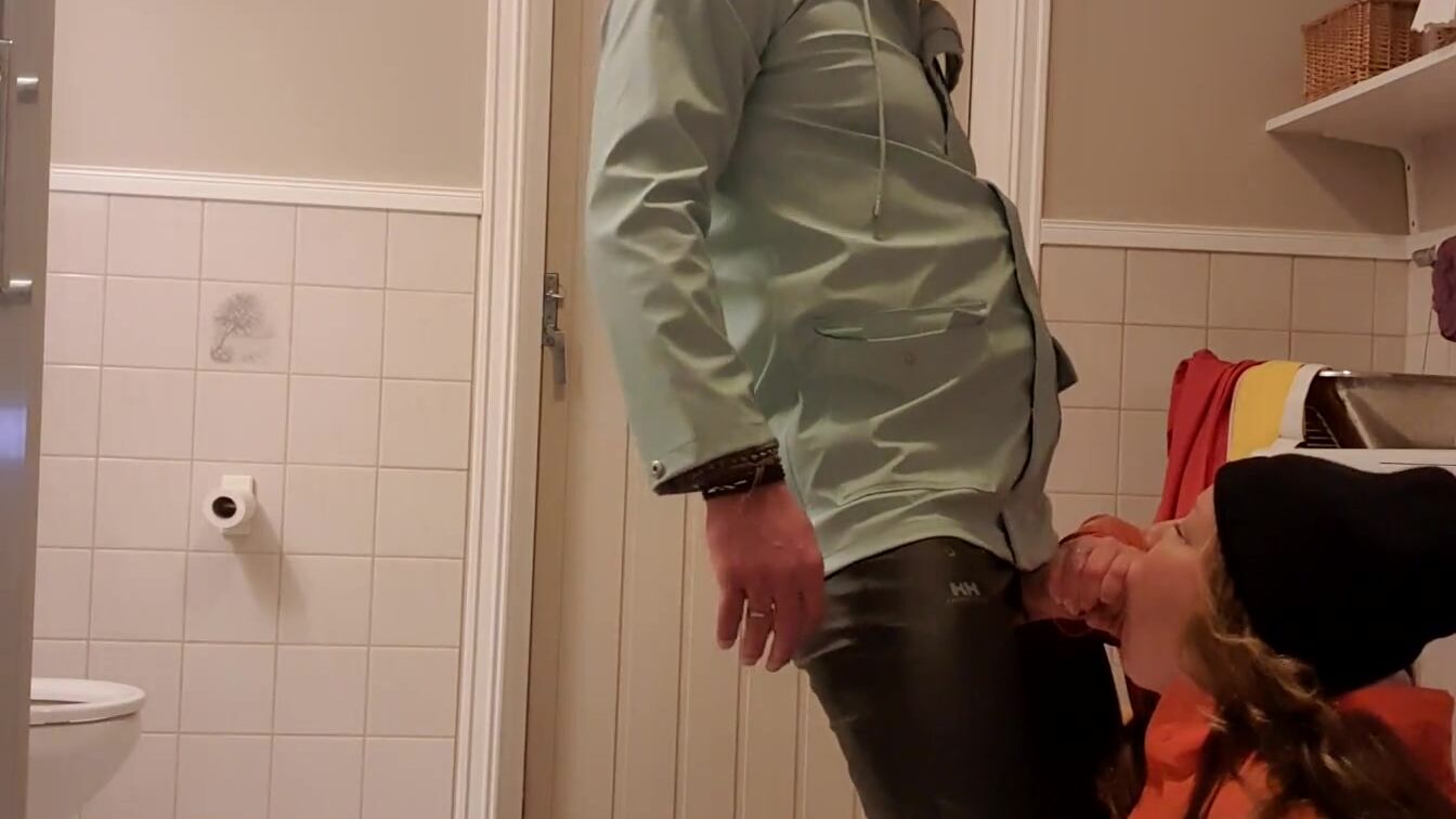 Sucking Off and wanking gigantic cock inside the WC into oily rainwear and latex boots