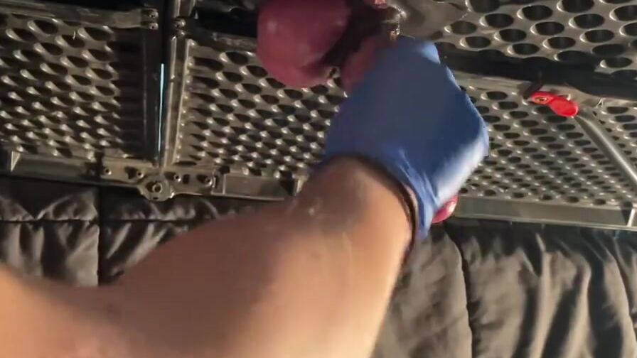 Milking table hand job with latex gloves.