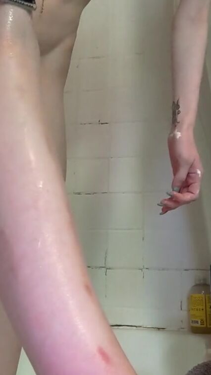 Shaving the legs with anal plug