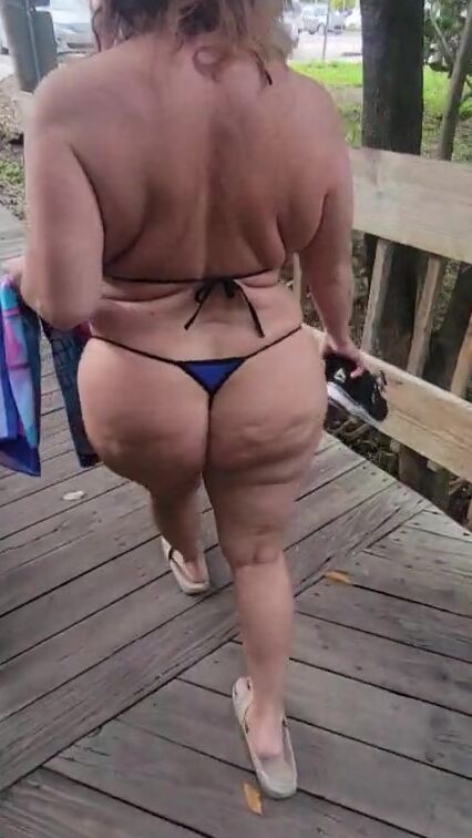 Milf walking into a g-string bikini