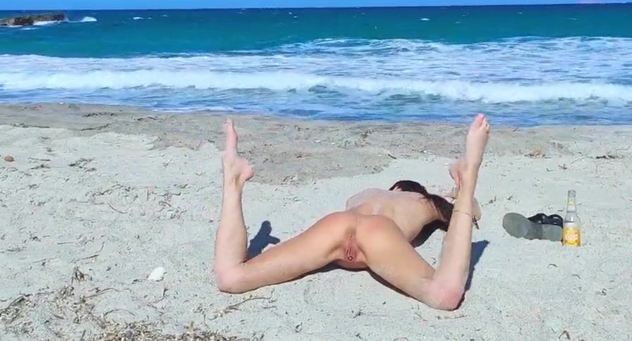 Turned On fiance inside action with a toy on the beach