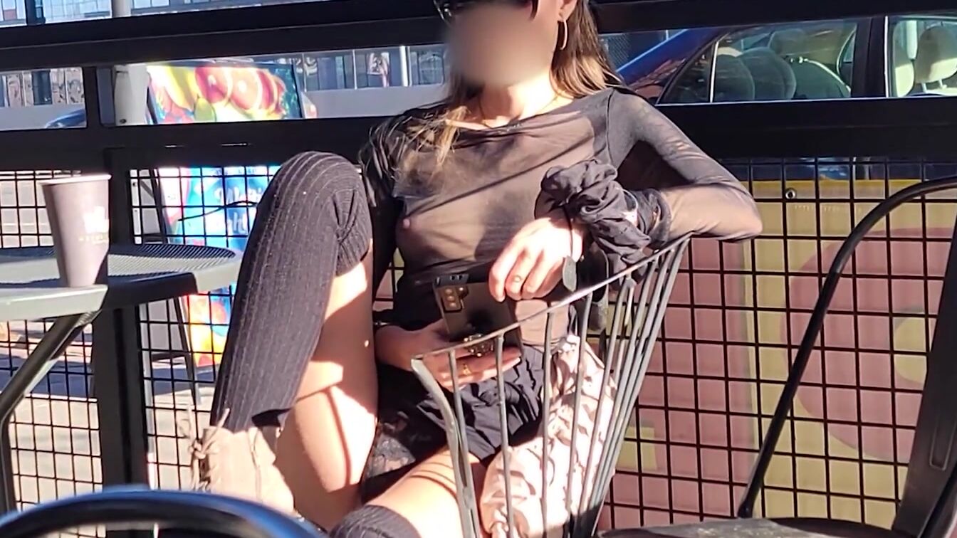 Showing off boobs into sheer top around town