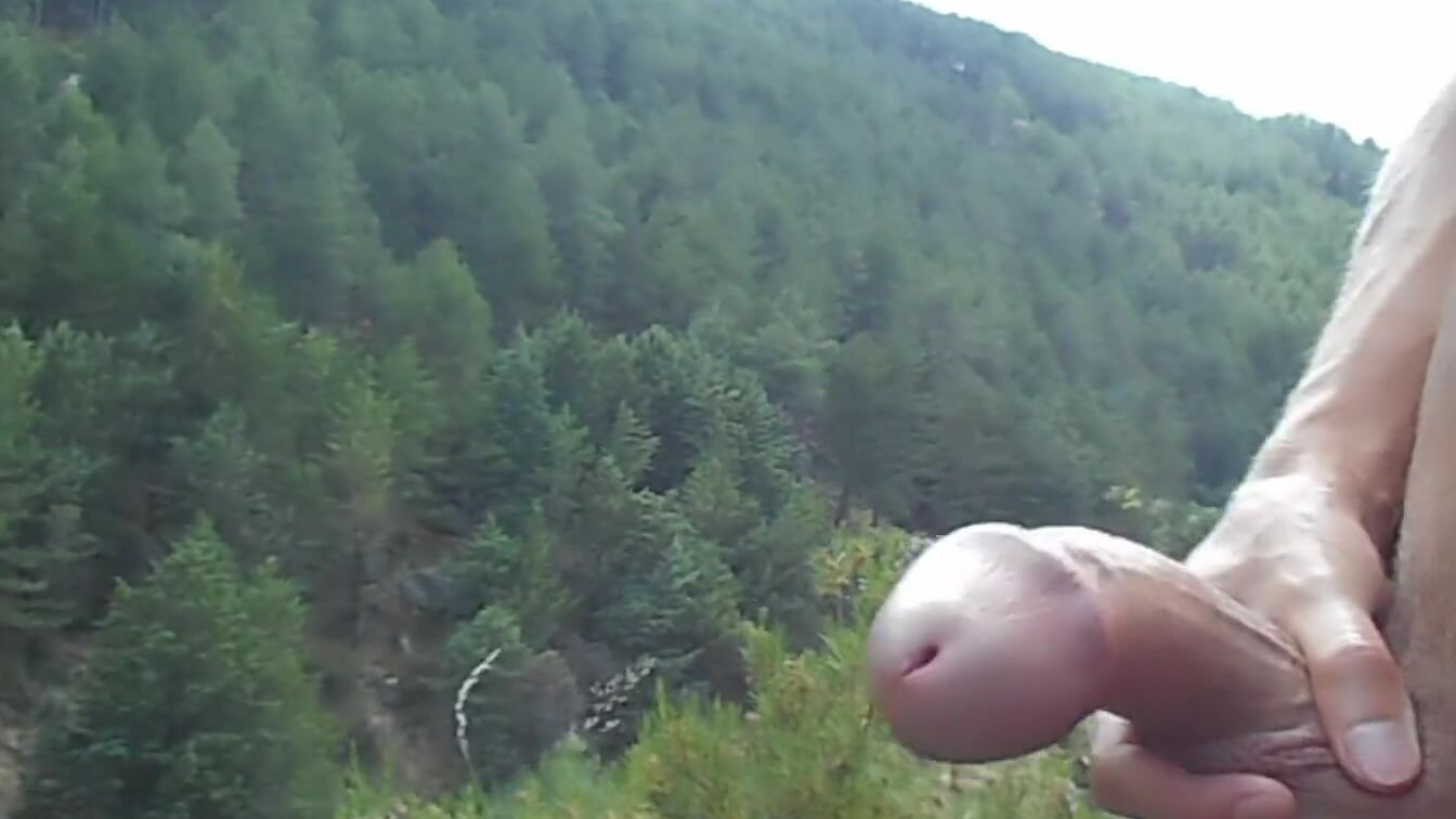 Wank with a watch. Masturbation on a mountain. Touching my skinny, oiled body public.