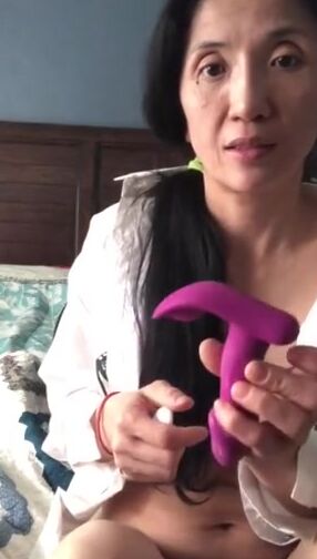 oriental Milf tries new vibrator from fan