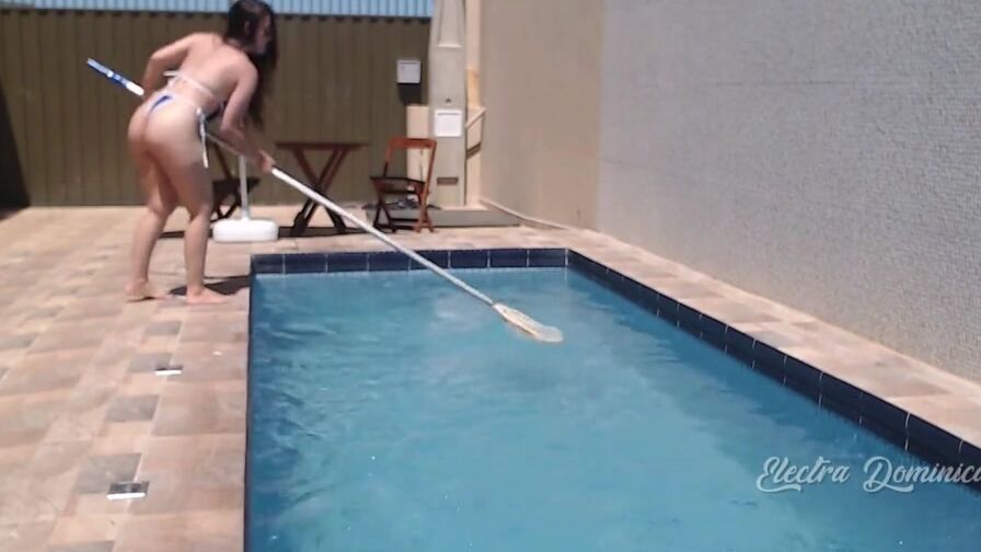 Very Goddess dark hair cleaning the pool