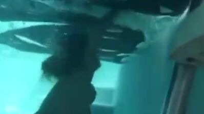 Topless girl drowning underwater
