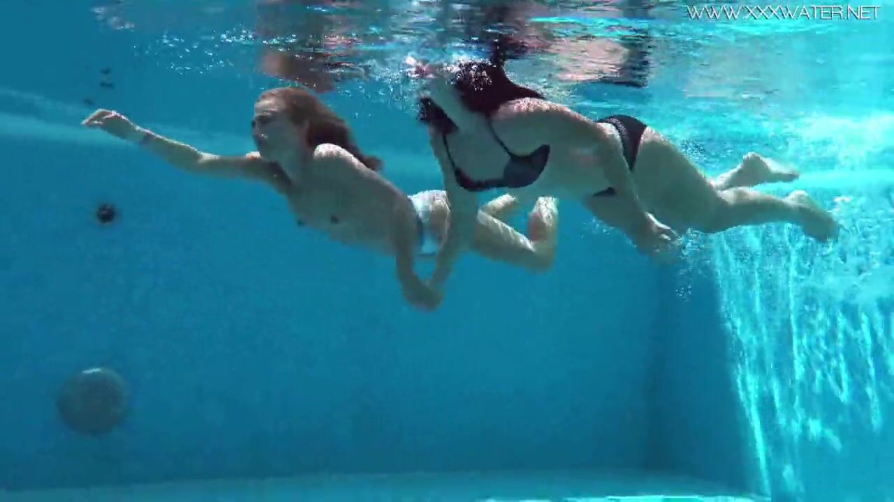 Jessica and Lindsay swim nude inside the pool